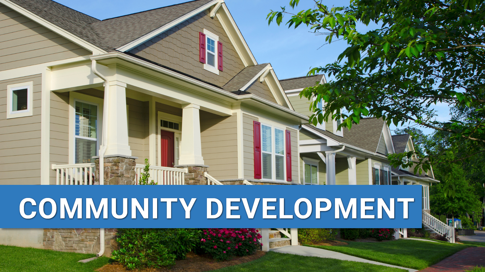 Houses on neighborhood street with text: Community Development.