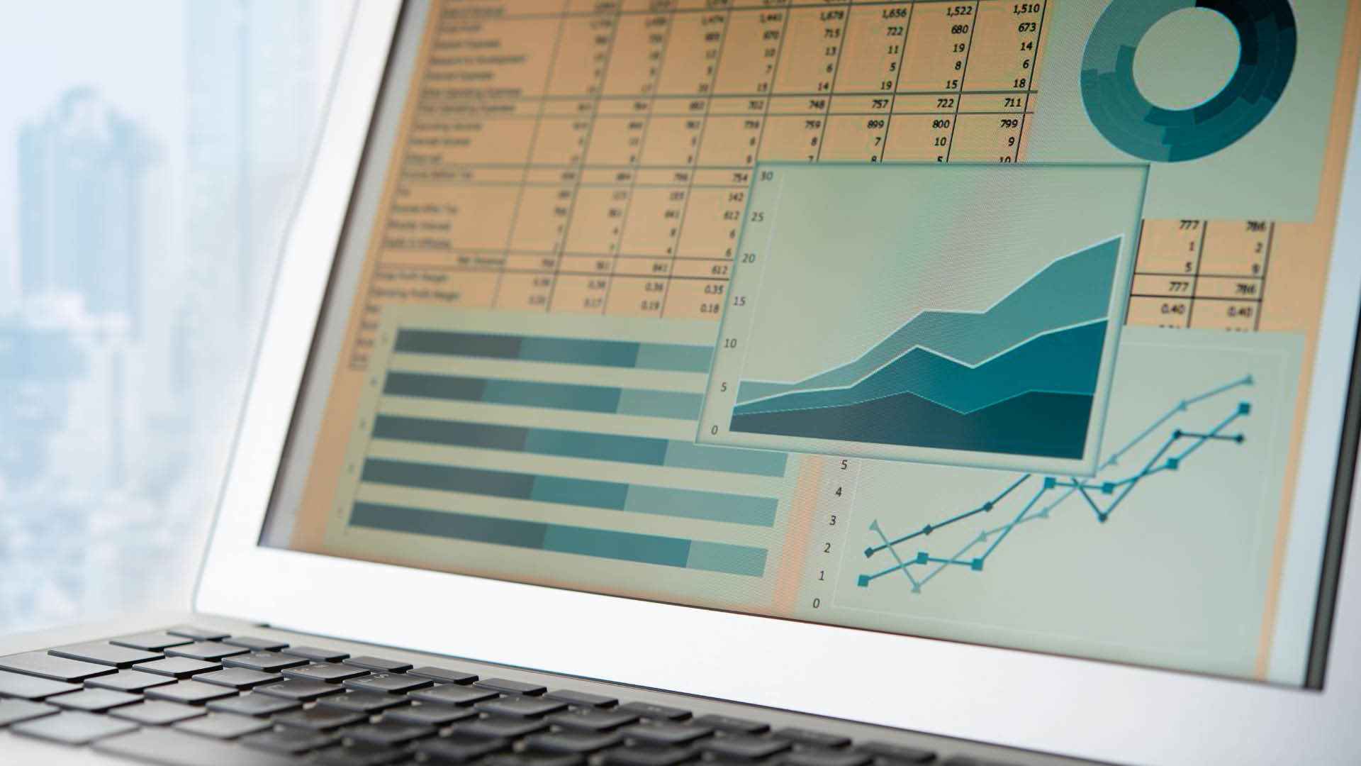 Close up of laptop with financial spreadheets