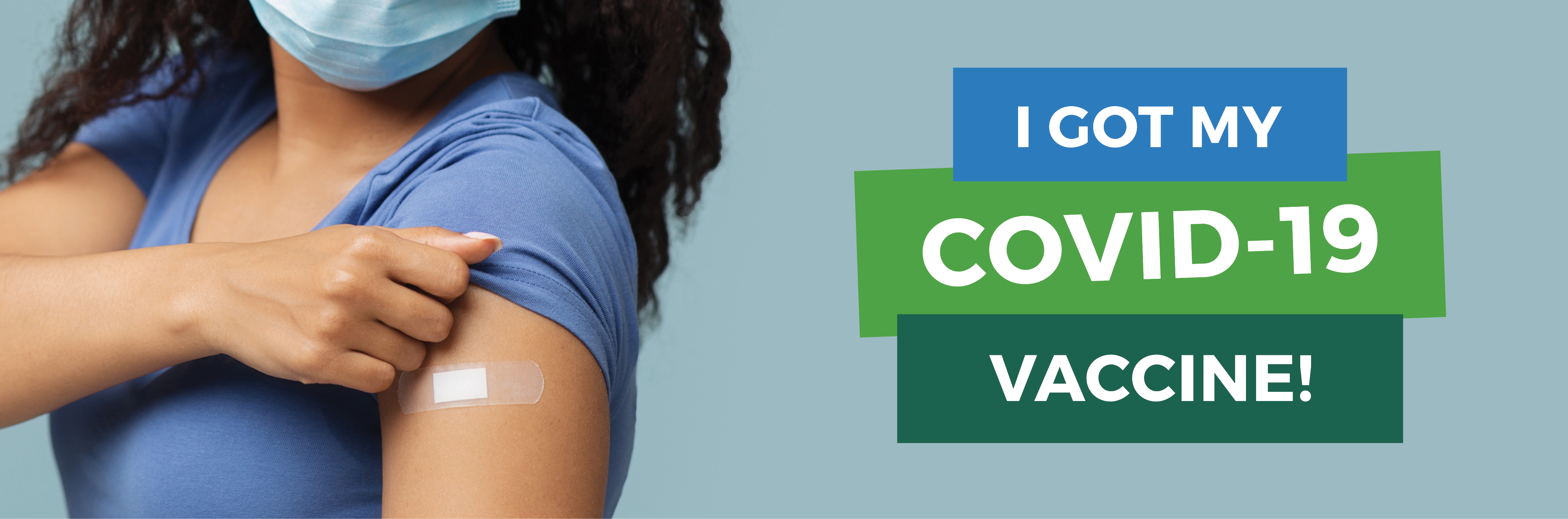close up of arm with band aid after a vaccination